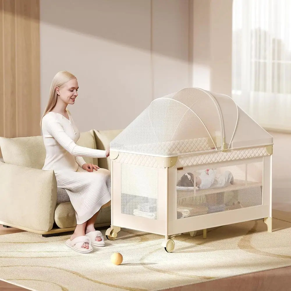 All-in-One Baby Bassinet, Play and Sleep Station, Bedside Crib with Diaper Changer, Storage, and Toy Bar for Newborns to Toddler