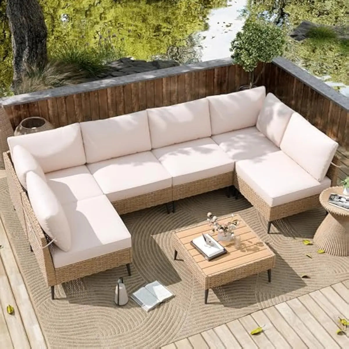 Outdoor sectional rattan sofa set with coffee table and cushions for garden poolside or terrace use weatherproof PE wicker powde